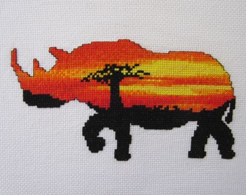 Climbing Goat Designs Sunset Rhinoceros printed cross stitch chart